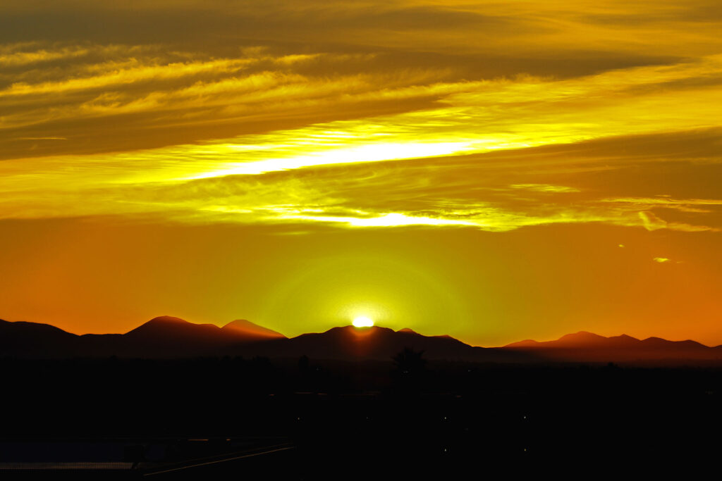 Sunrise over the mountains - Coronado Times