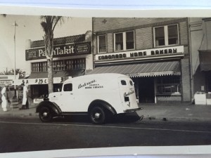 Anderson truck used for deliveries in front of original storefront