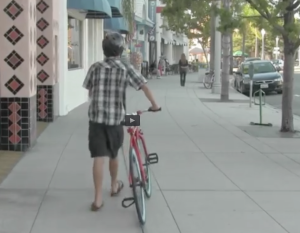 walk your bike on Orange Ave sidewalks
