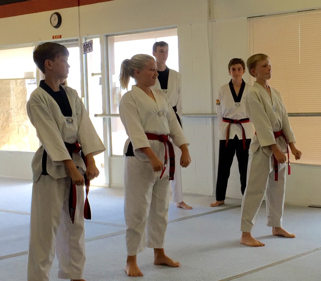 Grace, Grayson and Evan take the READY stance prior to testing - their GOAL - BECOME A BLACKBELT!"
