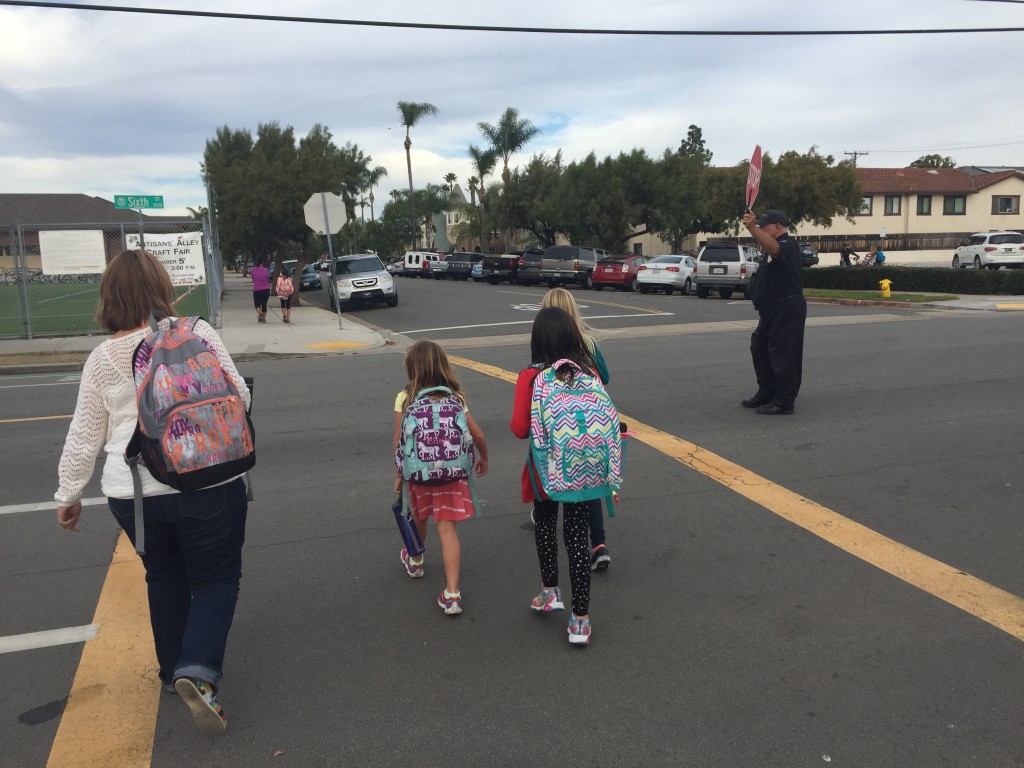 Another day of school finishes with Mr. Bruce stopping traffic so students and parents can cross the street.