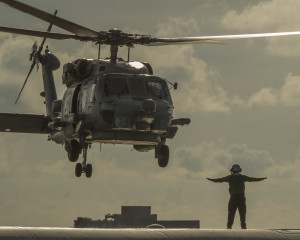 150513-N-TP834-267  CELEBUS SEA (May 13, 2015) An MH-60R Sea Hawk helicopter assigned to the Battle Cats of Helicopter Maritime Strike Squadron (HSM) 73 prepares to land aboard the aircraft carrier USS Carl Vinson (CVN 70). Carl Vinson and its embarked air wing, Carrier Air Wing (CVW) 17, are deployed to the 7th Fleet area of operations supporting security and stability in the Indo-Asia-Pacific region.  (U.S. Navy photo by Mass Communication Specialist 2nd Class John Philip Wagner, Jr./Released)