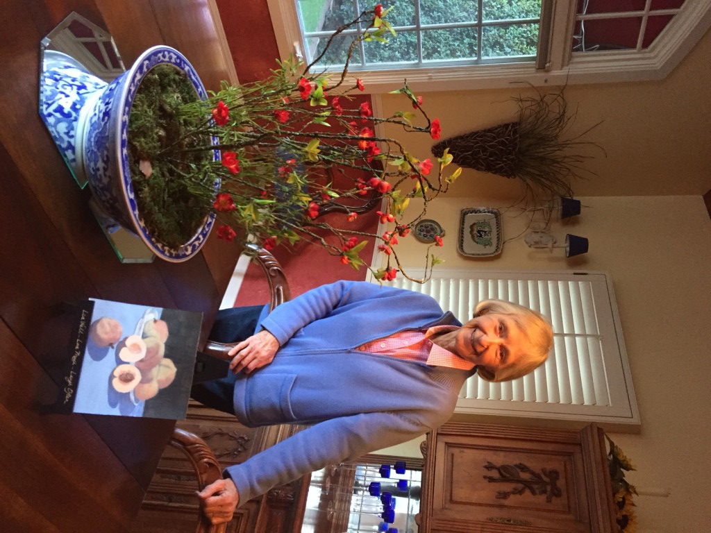 Peggy with two of her favorite pastimes…plants and paintings.