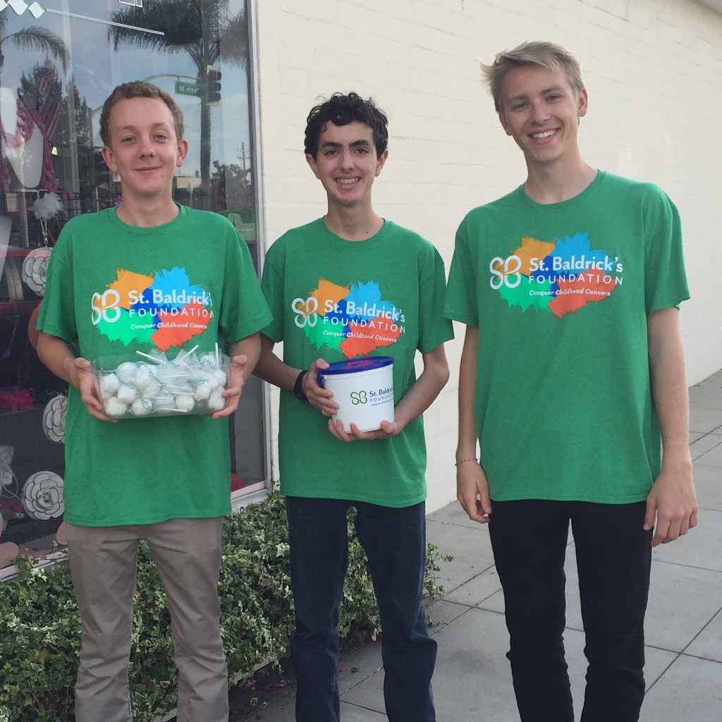 Charlie Clausen, Patrick Doyle, and Evan Arnold contributed to the fundraising efforts by walking around outside the barber shop to seek donations for the St. Baldrick's Foundation.