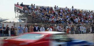 080928-N-1226D-403 CORONADO, Calif. (Sept. 28, 2008) A race car speeds in front of spectators on the flight line during a race at the Coronado Speed Festival at Naval Air Station North Island. More than 200 classic race cars participated in nine race categories throughout the weekend. Speed Fest, held Sept. 27-28, is one of many events taking place during San Diego Fleet Week 2008. (U.S. Navy photo by Seaman Mass Communication Specialist Omar A. Dominquez/Released)