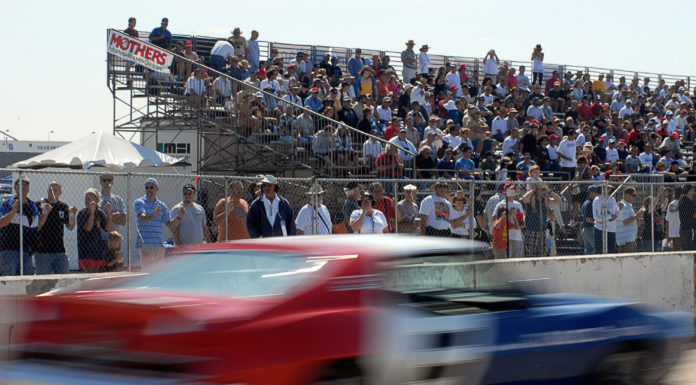080928-N-1226D-403 CORONADO, Calif. (Sept. 28, 2008) A race car speeds in front of spectators on the flight line during a race at the Coronado Speed Festival at Naval Air Station North Island. More than 200 classic race cars participated in nine race categories throughout the weekend. Speed Fest, held Sept. 27-28, is one of many events taking place during San Diego Fleet Week 2008. (U.S. Navy photo by Seaman Mass Communication Specialist Omar A. Dominquez/Released)
