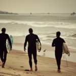 Cays Crew Walking Their Boards at Silver Strand