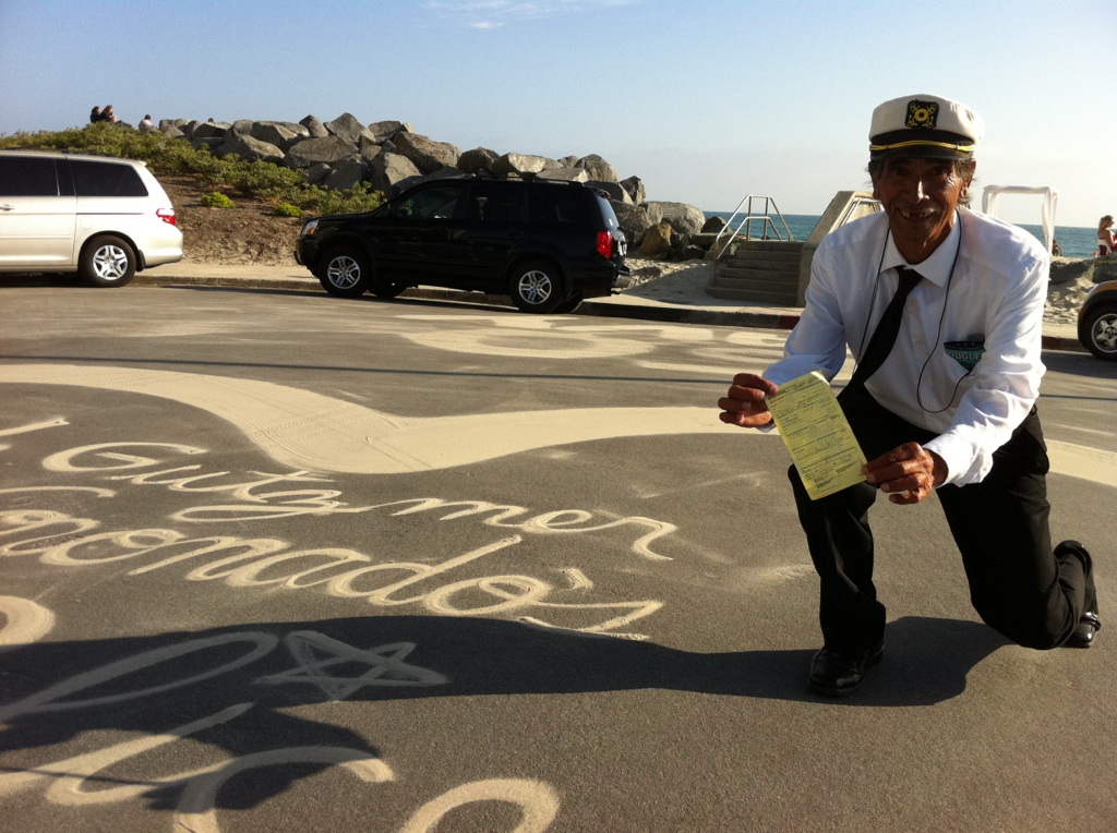 sandman Alberto Avila poses with ticket from 2013