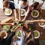 people toast friendsgiving