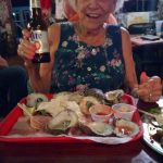 Margo Celebrating with Oysters and Beer