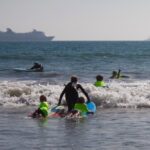 surfing ocean kids coach beach