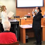 Councilmember Tanaka being sworn in