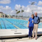 Judy & John Collins with large pool angel