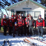 Snow Valley Ski Patrol in front of on-mountain building