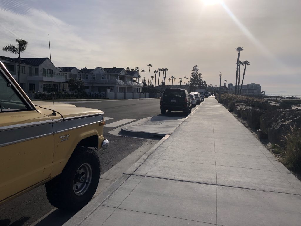 Ocean Boulevard sidewalk bulb-out with nearby parked cars 2023-02-18