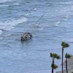 sailboat washed ashore