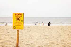 sewage-closures beach sign
