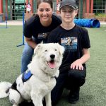 Bryson and therapy dog Miso with Counselor Rabe