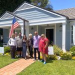 group with flag house