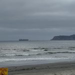 2024-05-28 beach sign clouds sewage keep out of water sign