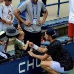 Ryan fist bump with young fan