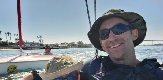 Son and father sailing with the KMAC Foundation.