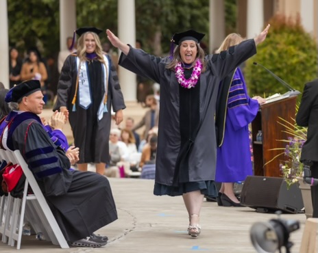 Sara Stillman walking across the stage at law school graduation. Sara Stillman walking across the stage at law school graduation, April 2024. Photo submitted by Sara Stillman.