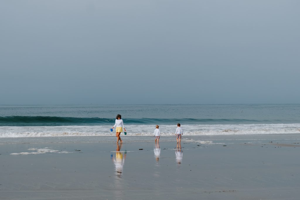 Coronado beach featuring a mom and two children.