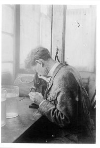 William E. Ritter at the Boathouse with a microscope.