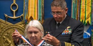 Karol McClelland, President of Coronado Rotary Club, receives a medallion during the 2026 Spirit of Hope (SoH) Award ceremony in the Pentagon Hall of Heroes in Arlington, Virginia, Sept. 23, 2026. Robert Salesses, Department of War Director of Administration and Management, hosted the event. (U.S. Army photo by Christopher Kaufmann)