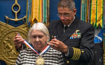 News briefs: Awards bestowed, local artist exhibition, SD bayside park gets new name Karol McClelland, President of Coronado Rotary Club, receives a medallion during the 2026 Spirit of Hope (SoH) Award ceremony in the Pentagon Hall of Heroes in Arlington, Virginia, Sept. 23, 2026. Robert Salesses, Department of War Director of Administration and Management, hosted the event. (U.S. Army photo by Christopher Kaufmann)
