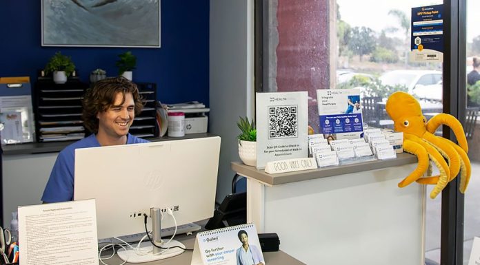 A Healthtopia clinical care worker at the reception area of integrative primary care in San Diego