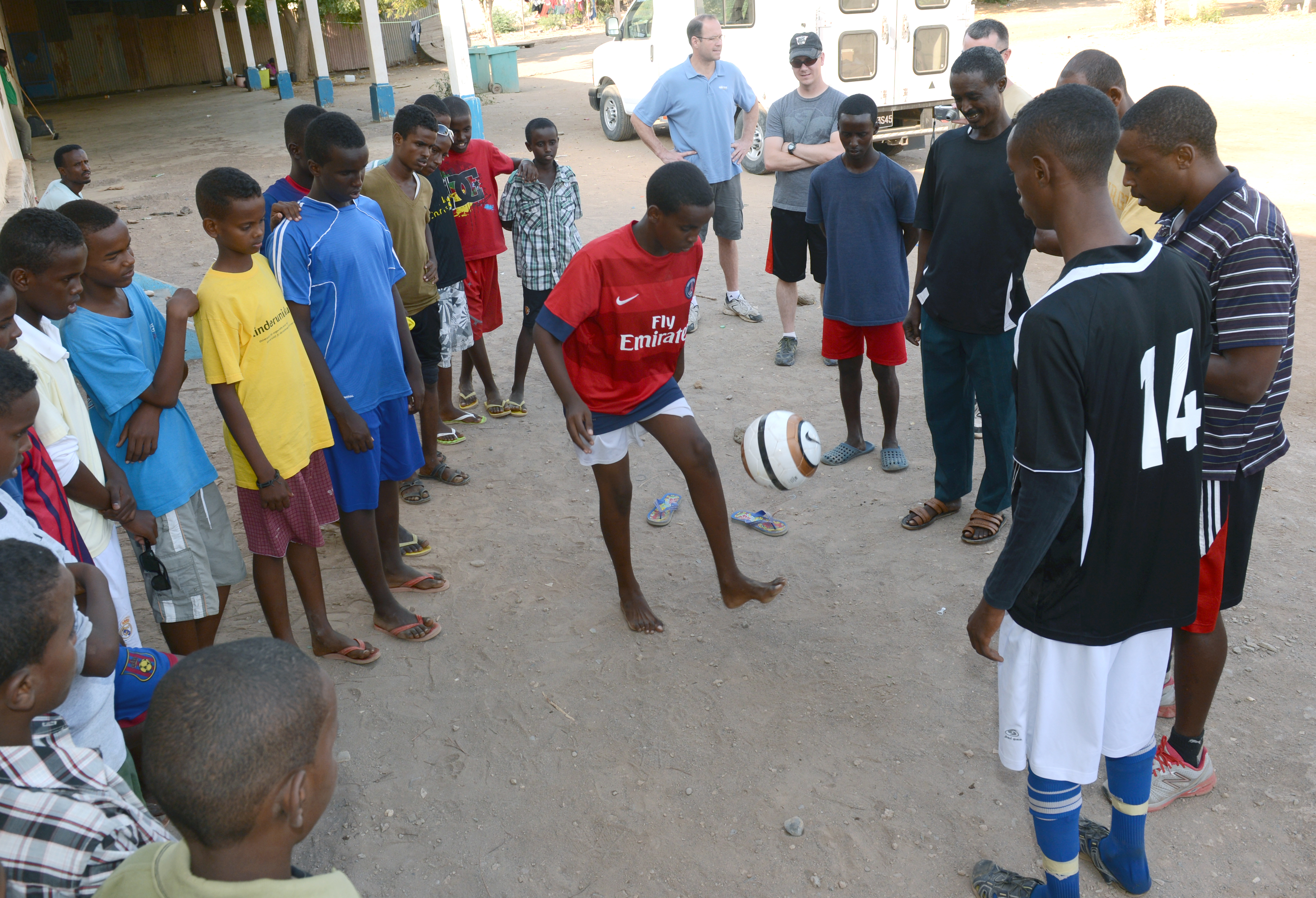 Compassion Kids and CYSL Collecting Soccer Balls for